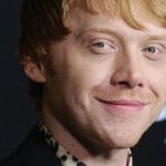 Rupert Grint says he's never watched all the Harry Potter movies and doesn't expect an invitation to TV series